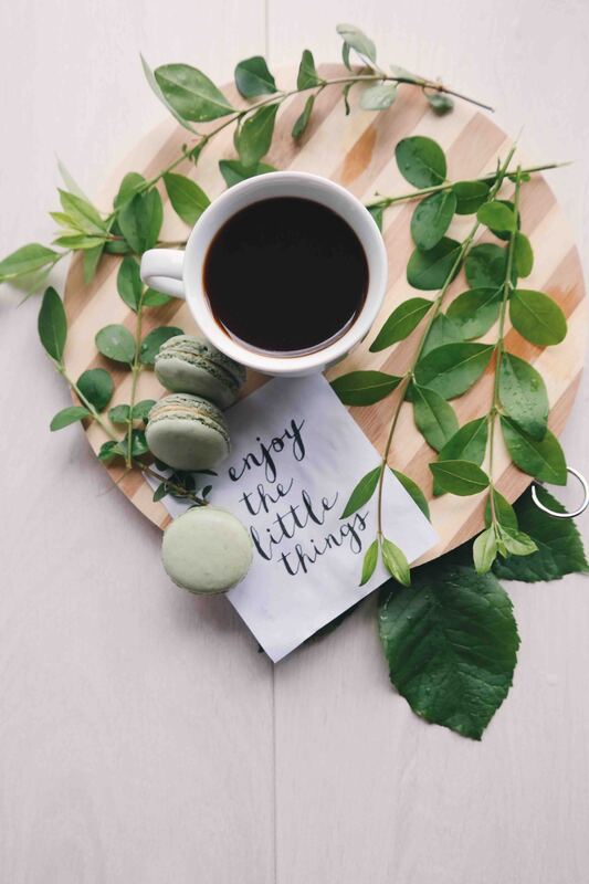 quote card next to coffee saying enjoy the little things